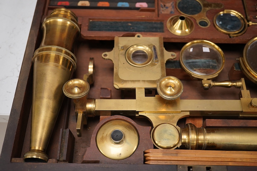 A mid 19th century folding compound and simple monocular microscope by William Harris & Co. 50 High Holborn, London, in its fitted mahogany case with paper maker’s label to inside of the lid. Condition - fair to good, so